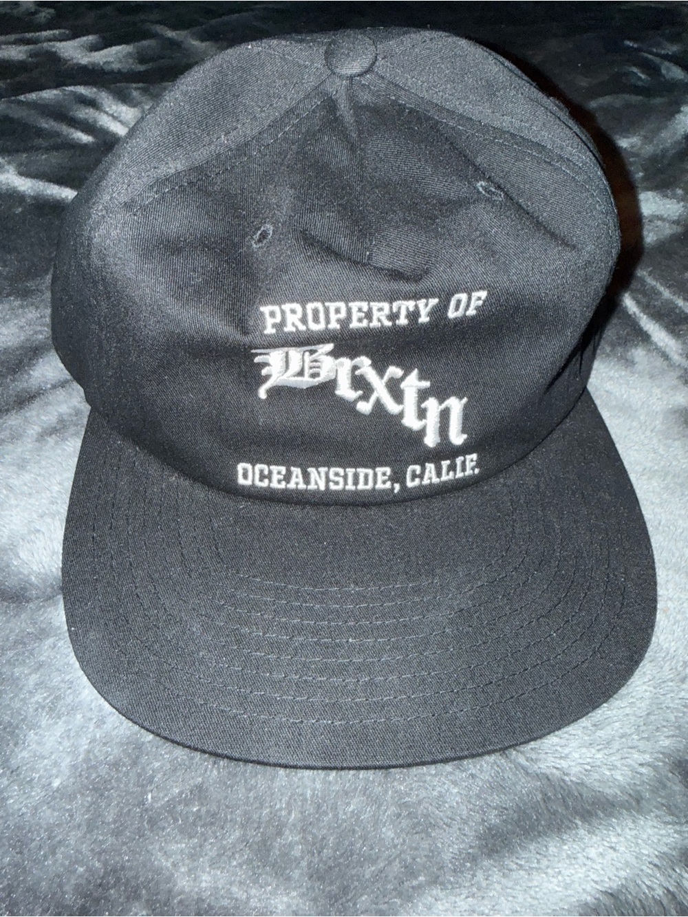 Brixton Black Cap "Property of Brixton" with White Embroidery